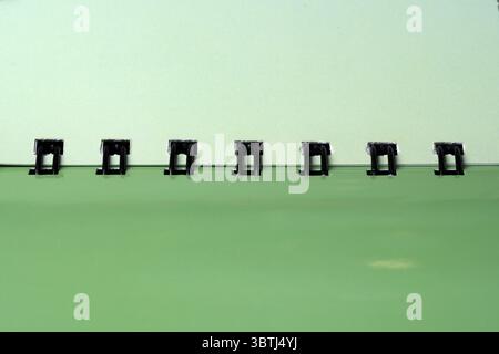 Opened cover of a green spiral notepad for writing with space for placing information and text Stock Photo