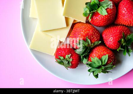 London UK, July 15 2025, Fresh Ripe Organic Strawberries With White Chocolate Squares Stock Photo