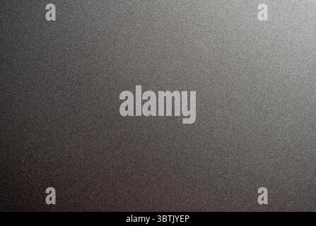 Full frame background texture of dark grey brushed metallic surface with subtle light gradient. Stock Photo