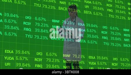Typing female scientist wearing lab coat analyzing data in tech lab, with laptop, holographic grid Stock Photo