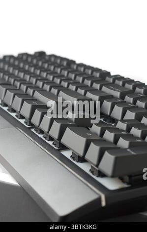 side view of black mechanical gaming keyboard isolated white background, showing height and slope of the keys, designed for intense gaming or typing Stock Photo