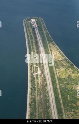 Oresund Bridge - Aerial view showing the end of the bridge and the artificial island of Peberholm and start of the Oresund Tunnel to Denmark Stock Photo
