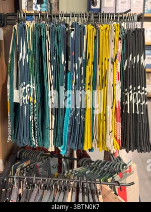 Hanging Printed Bandanas in Earth-Tone Palette,Organized Textile Rack Stock Photo