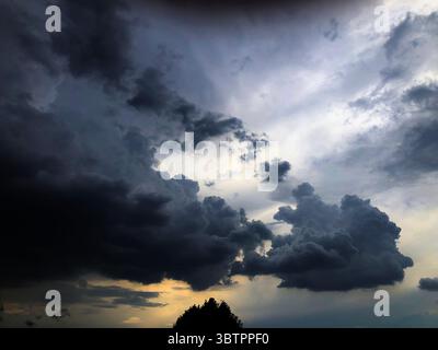 The Sun Setting Behind a Clearing Storm Stock Photo
