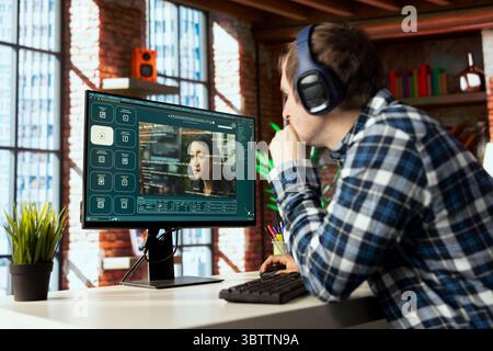 Graphic editor at workstation arranging interface elements in PC software, positioning buttons, placing text input fields for AI GPT functions, linking output controls, structuring navigation menus Stock Photo