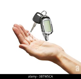 Car key in a hand, isolated on white background Stock Photo