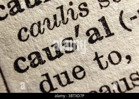 Word causal on dictionary page, macro close-up Stock Photo