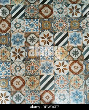 Various vintage tile patterns are laid together in a chic and colorful way. Stock Photo
