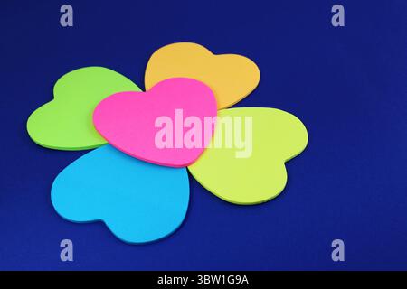 Heart-shaped sticky notes that form a flower Stock Photo