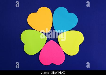 Heart-shaped sticky notes that form a flower and a star Stock Photo