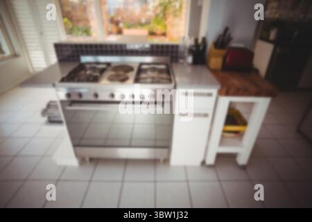 Flat design home kitchen is featuring stainless steel stove on island with red toaster, backsplash Stock Photo