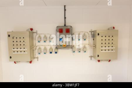 Wall-mounted electrical distribution is showing flat style with boxes, panel, sockets, cables Stock Photo