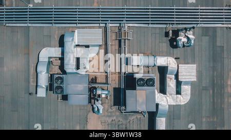 Chillers with air ducts on the roof of the building. Climate control. View from above Stock Photo