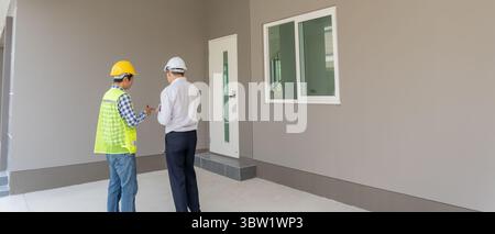 Engineers team and owner discuss check and review the laptop of construction. Contractor inspection drawing before start project civil. project planni Stock Photo