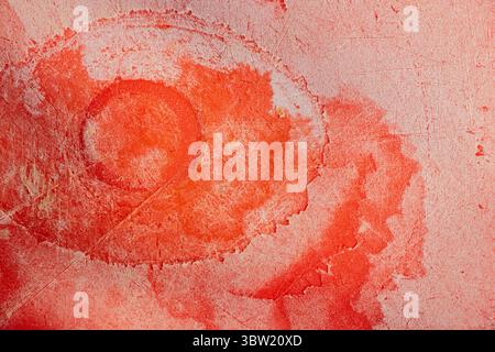 Red plastic kitchen cutting board with scratches and cuts as background close-up Stock Photo