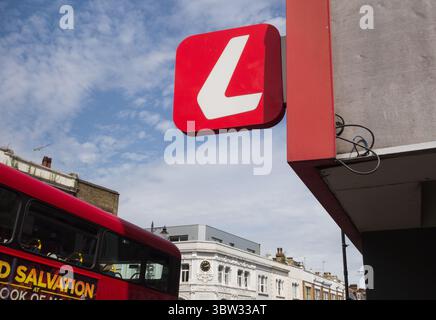 Ladbrokes signage outside Putney High Street bookmakers and betting shop, Putney, London, SW15, England, UK Stock Photo