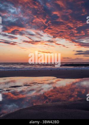 Dramatic Sunset at a beach on the island Sylt, Germany Stock Photo