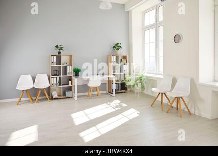 Empty modern office workplace with wooden table, boardroom with desk, chairs for group briefing Stock Photo