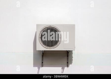 Air conditioning outdoor unit compressor install outside the building. Stock Photo