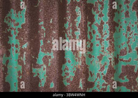 Galvanized steel sheet is pale green and rusty. Stock Photo