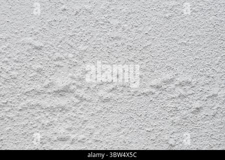 Old concrete wall with blistered paint and air bubbles Stock Photo