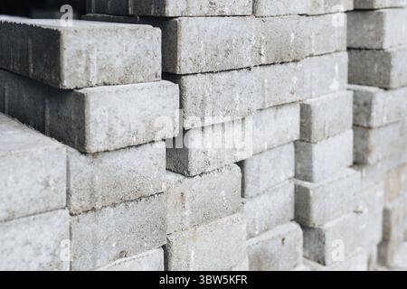 Gray silicate bricks are stacked. Industrial background. Concept of construction Stock Photo