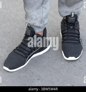 Man black sport sneakers close up Stock Photo