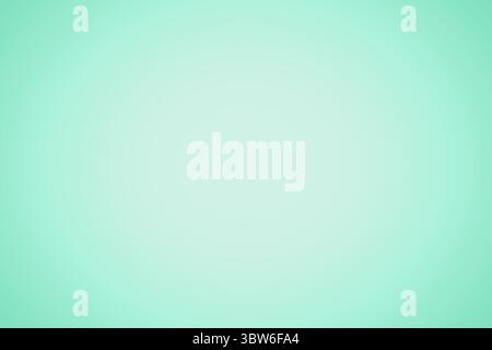 Mint green gradient background is glowing softly with subtle radial fade in flat design, copy space Stock Photo