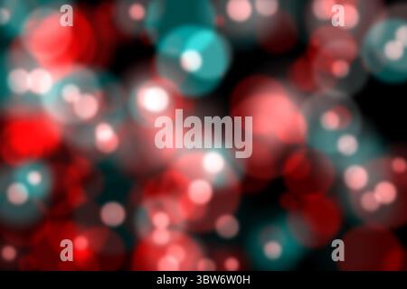 Overlapping red and teal glows are appearing in flat design abstract bokeh on dark background Stock Photo