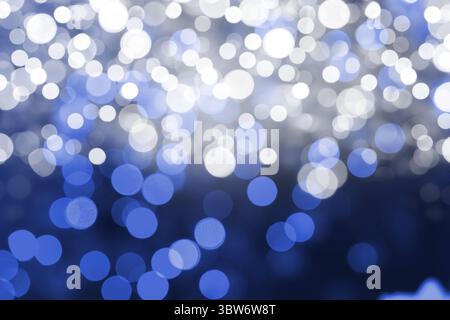 Flat design pattern is showing overlapping white and blue bokeh light circles glowing across frame Stock Photo