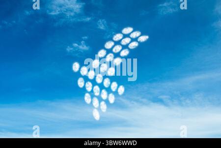 Cloud clusters forming arrow shape is pointing upward right in flat design with bright blue sky Stock Photo