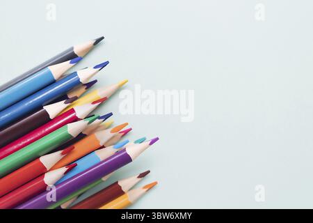 Background with colored pencils and space for copying. Top view. Creative background Stock Photo