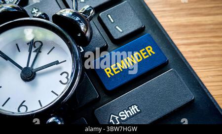 Reminder Button on Keyboard with Alarm Clock Stock Photo