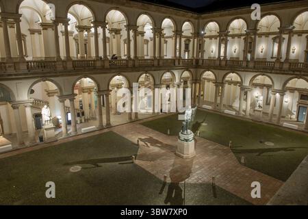 Milan Italy December 20, 2024: Courtyard of the Academy of Fine Arts of Brera in Milan at night illuminated Stock Photo