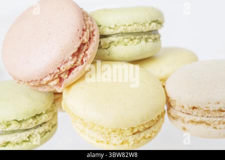 Several multicolored macaroons pastel colors isolated on white background Stock Photo