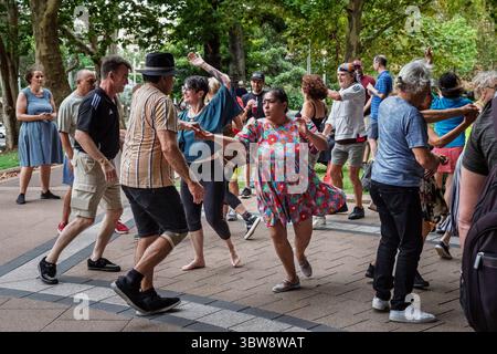 Salsa dancing in Hyde Park, Sydney, New South Wales, Australia Stock Photo