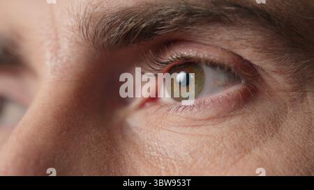 Close up focused eyes man businessman think idea middle-aged guy business employer in office thoughtful consider Caucasian male portrait wisdom Stock Photo