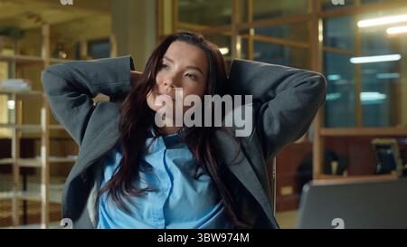 Asian business woman engineer architect at office desk project windmill electricity power company tired businesswoman Chinese Korean Japanese girl Stock Photo