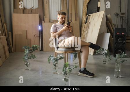 Portrait of frustrated confused frown guy, Sad upset handsome man read negative news on smartphone Stock Photo