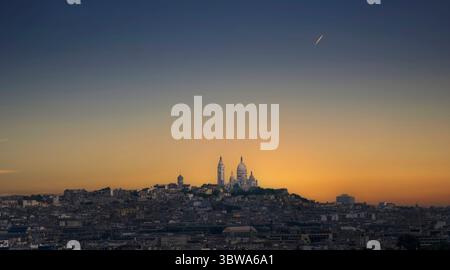 The Sacre-Coeur Basilica, a Roman Catholic Church on the summit of Montmartre, in Paris, France. Stock Photo