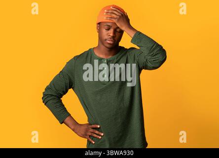 Oh No. Portrait Of Upset Young Black Guy Touching Head In Despair Stock Photo