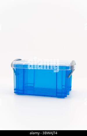 small transparent plastic containers on a white surface Stock Photo