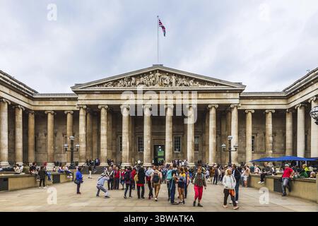 The British Museum in London, showcasing its grand neoclassical architecture with visitors outside Stock Photo