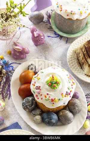 Festive Easter table setting. Easter orthodox cakes with Easter eggs Stock Photo