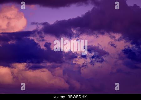Gorgeous dramatic sunset sky with pink and purple clouds. Abstract nature background Stock Photo