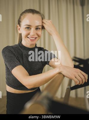 Portrait Active young woman portrait female ballet or contemporary dance teacher class in studio Stock Photo
