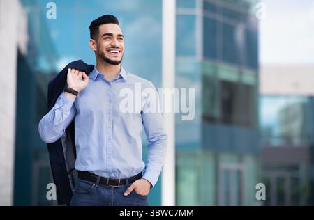 Happy muslim entrepreneur going home from job Stock Photo