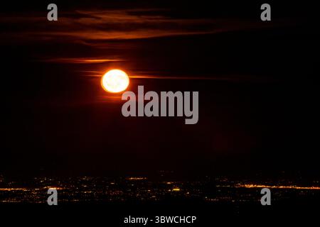 WA28507-00...WASHINGTON - Moon rise over Seattle viewed from the Buckhorn Wilderness Area. Stock Photo