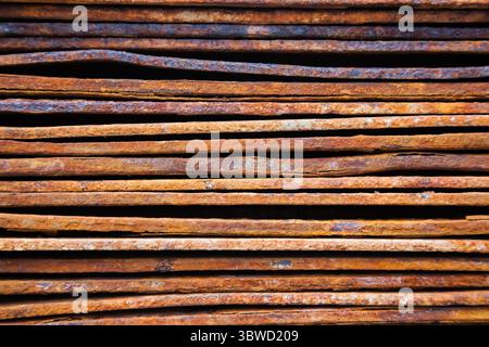Texture of rusty plates stacked in a stack close up. Side view. Stock Photo