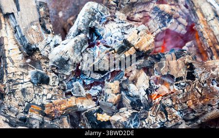 Close-up of smoldering wood and the heat from the coals. Stock Photo